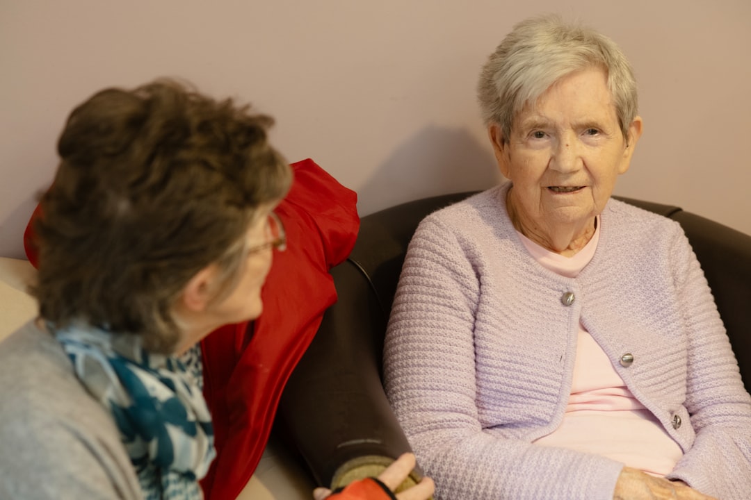 family caregiver talking with elderly parent, supportive conversation, mental health care