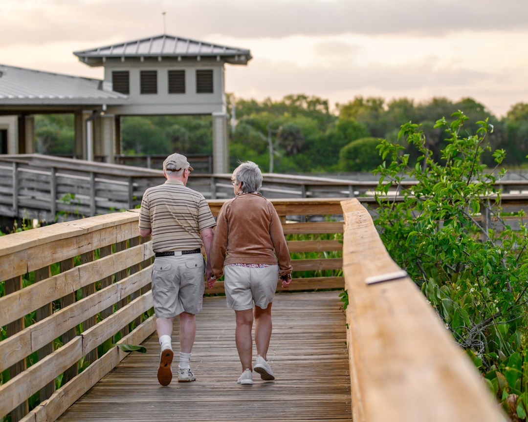 elderly couple exercising outdoors, healthy aging lifestyle 2026