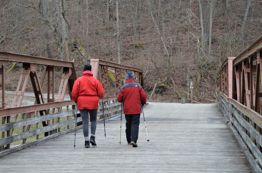 elderly person hiking outdoors healthy lifestyle 2026