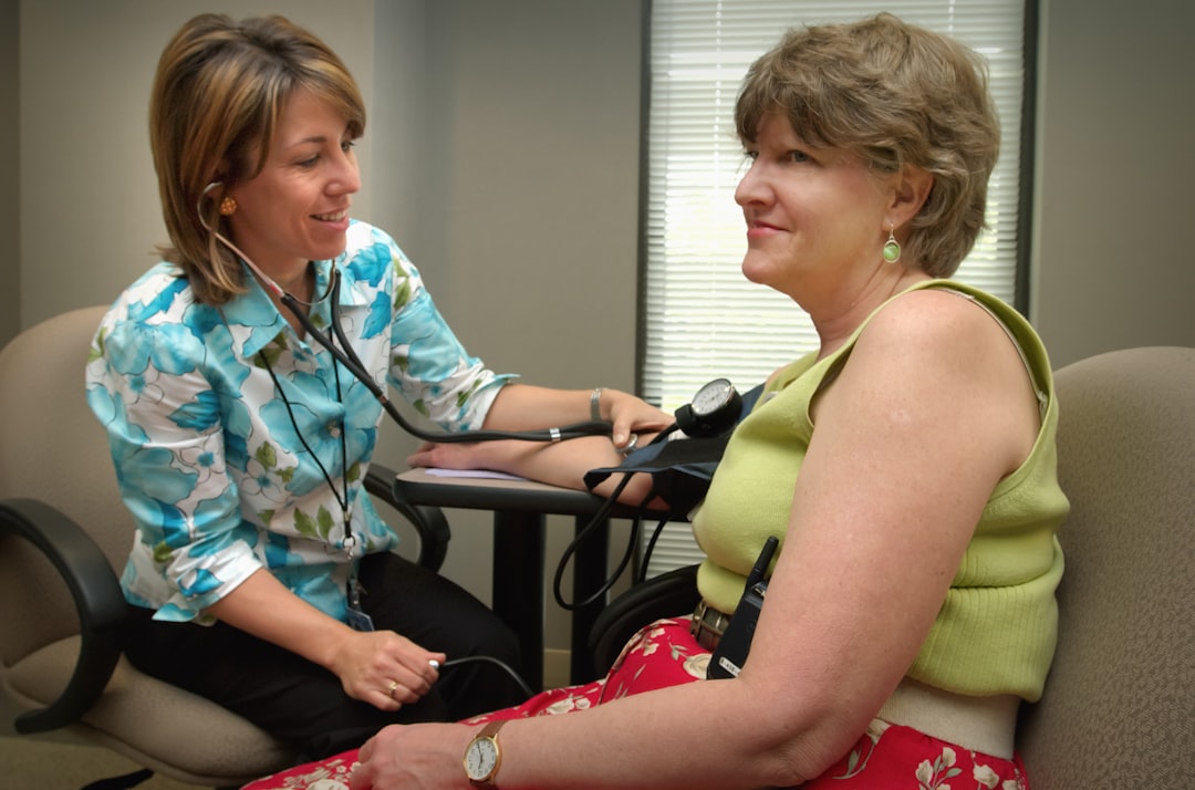 elderly woman blood pressure monitoring doctor consultation 2026