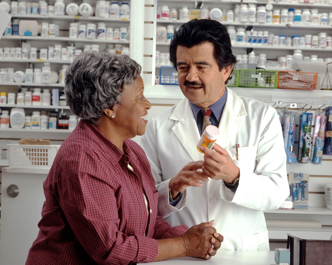 senior medication management pill organizer, elderly patient doctor consultation 2026